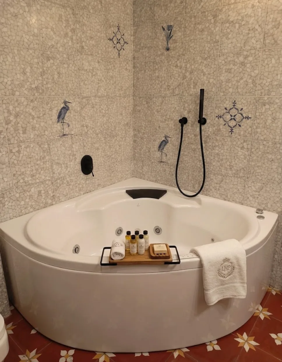 Private Jacuzzi in a Colonial Suite at La Maison Pondichéry, with mosaic tiles and terracotta floor
